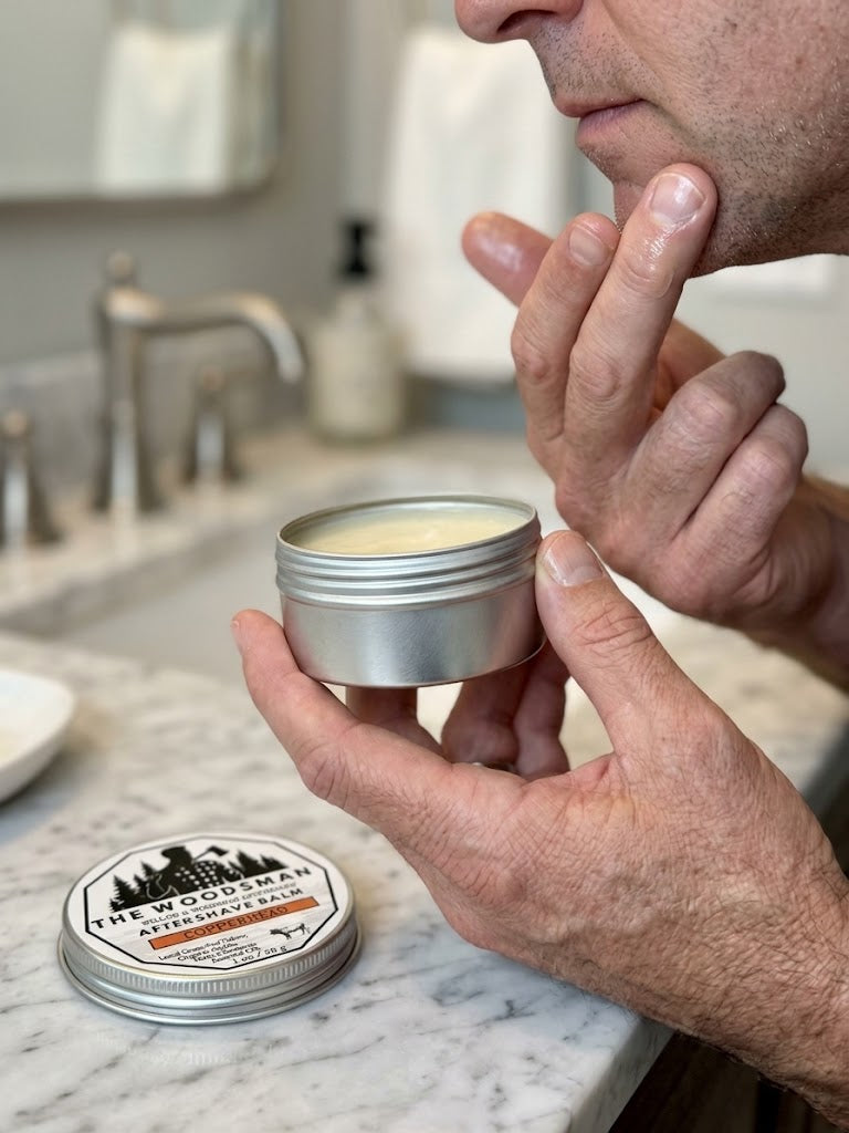 Man applying Copperhead Aftershave Balm to face